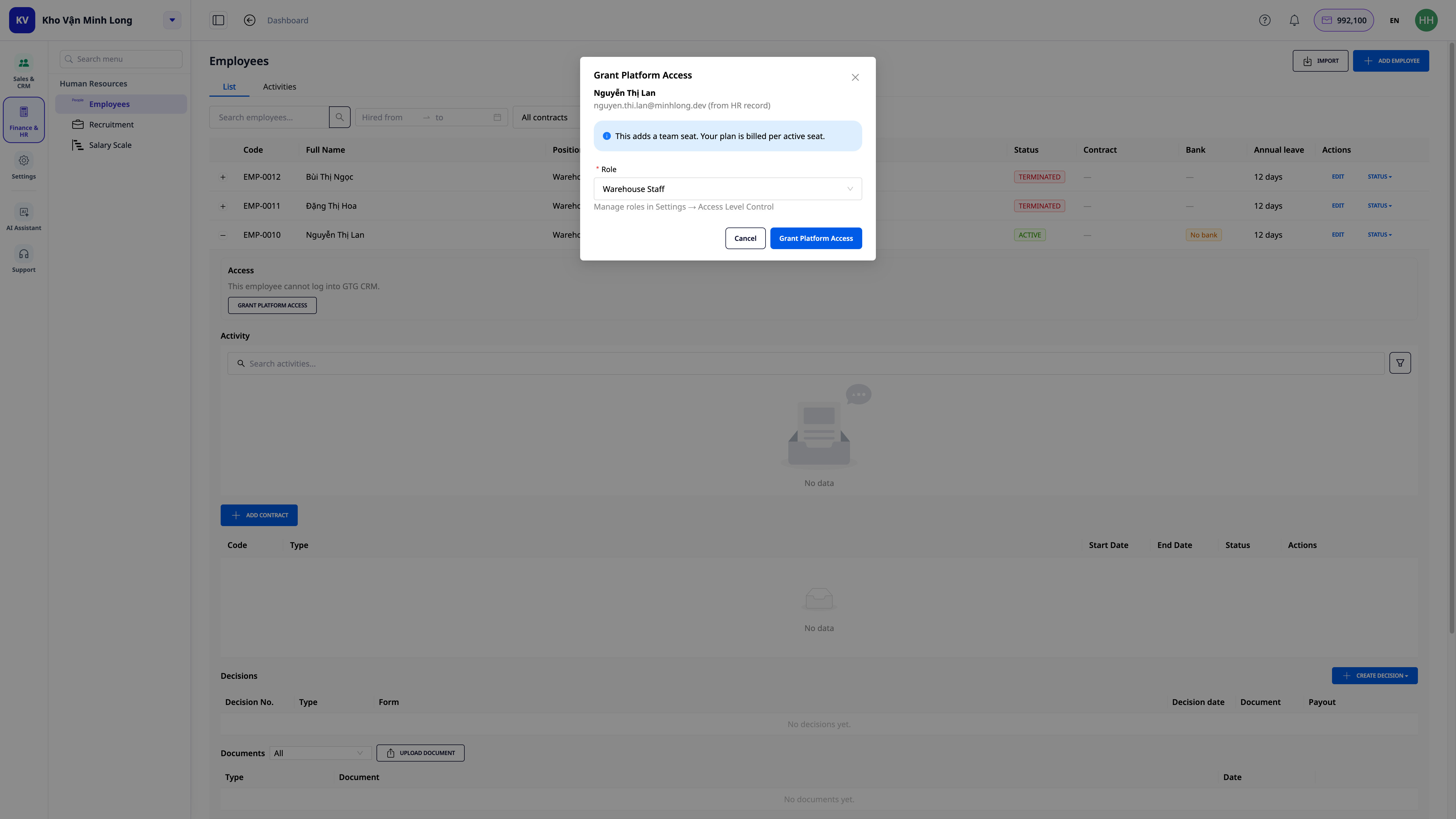 Grant Platform Access Modal — roles are pre-suggested by job title, with a note indicating an additional seat will be added to the plan, real screenshot on GTG CRM