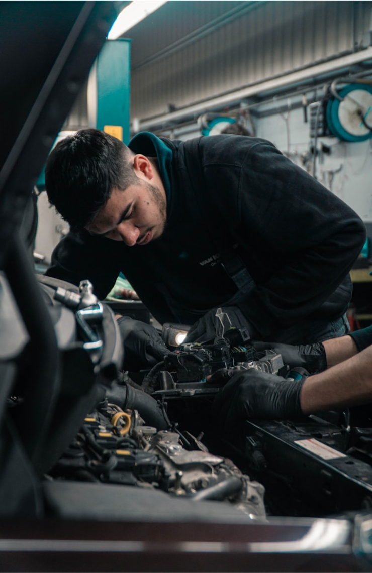 Mechanic performing detailed engine diagnostics 2