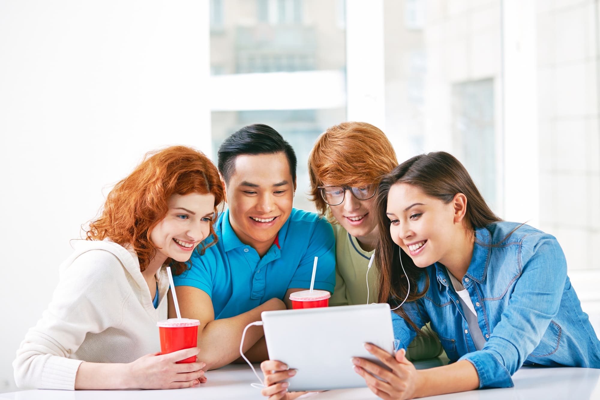 Students learning together with tablet