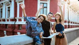 Group of diverse international students celebrating graduation day.